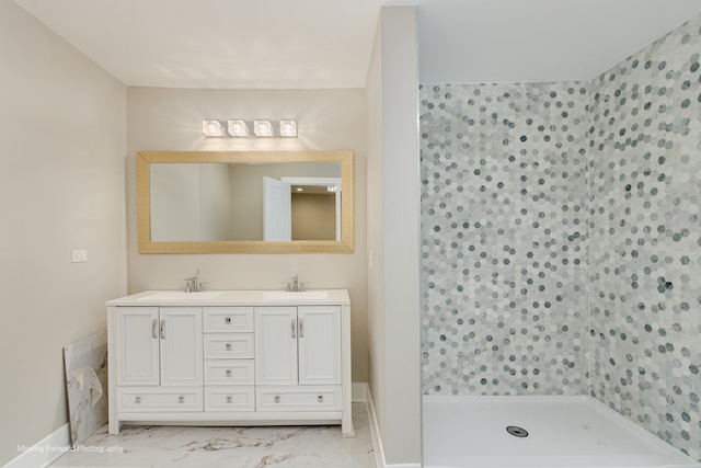 bathroom with a shower and vanity