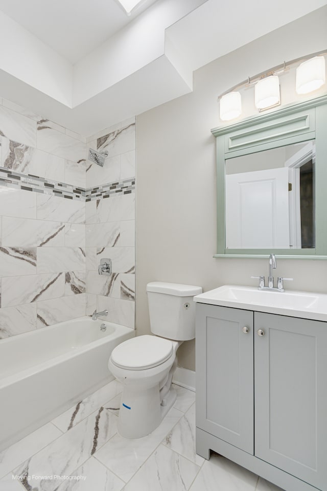 full bathroom featuring vanity, toilet, and tiled shower / bath