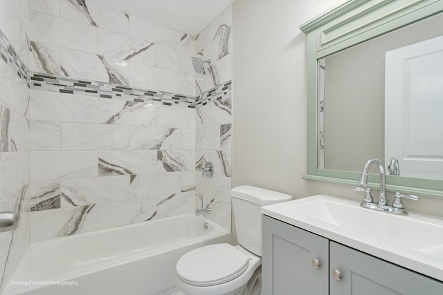 full bathroom featuring toilet, tiled shower / bath combo, and vanity