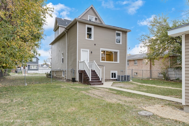 rear view of house with a lawn