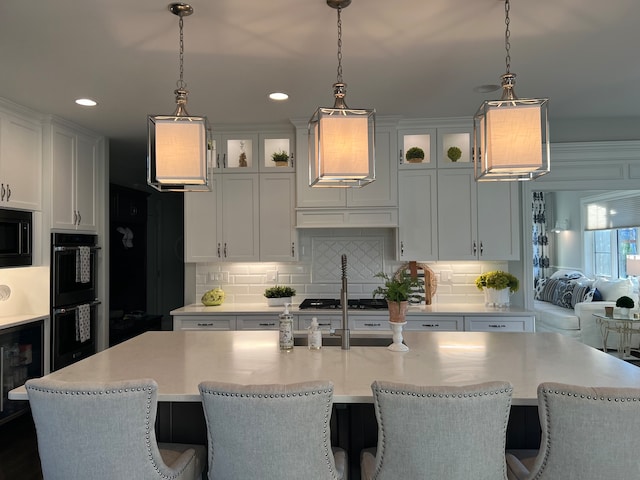 kitchen featuring white cabinets and pendant lighting