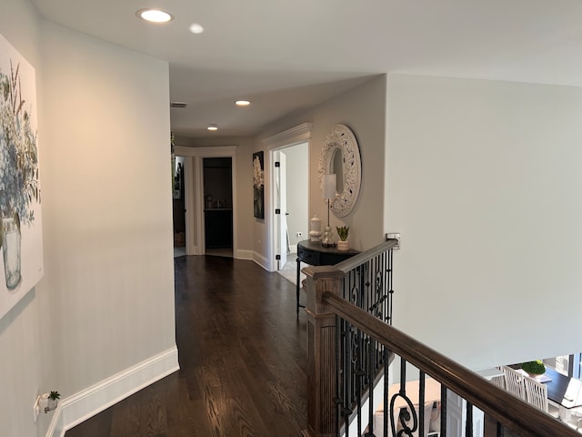 hall with dark hardwood / wood-style floors