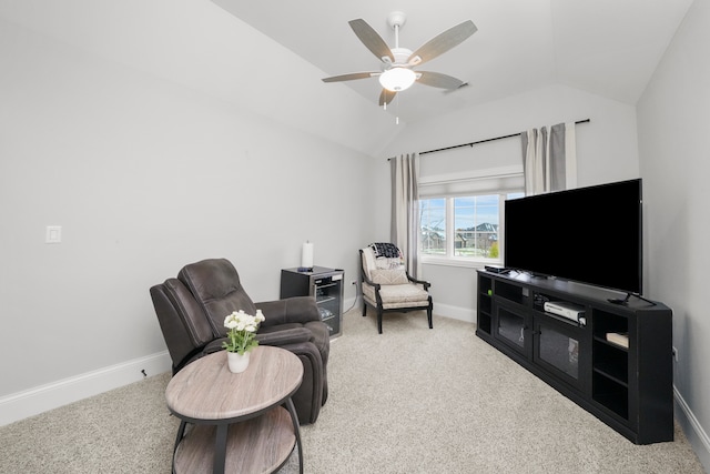 living room with ceiling fan, carpet, and lofted ceiling