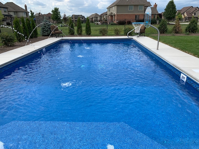 view of pool with pool water feature