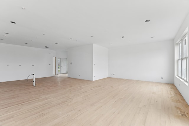 unfurnished room with light hardwood / wood-style flooring