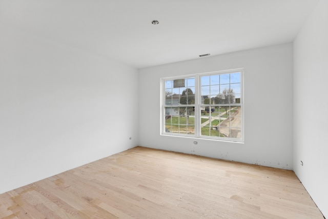 unfurnished room featuring light hardwood / wood-style flooring