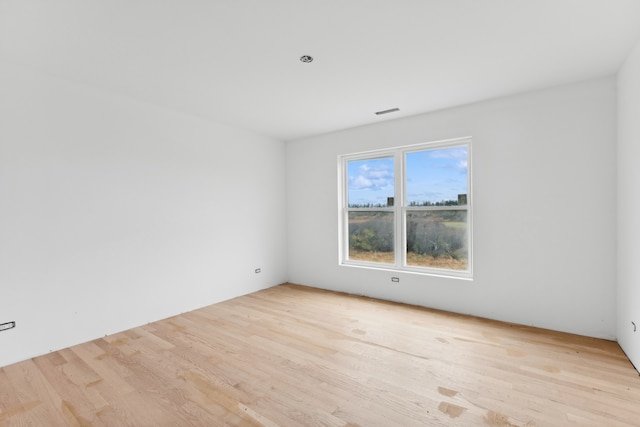 empty room with light wood-type flooring