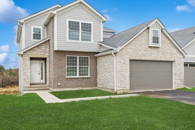 view of front of property with a front lawn and a garage