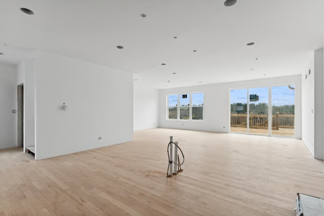 unfurnished living room featuring light wood-type flooring