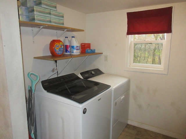 clothes washing area featuring separate washer and dryer