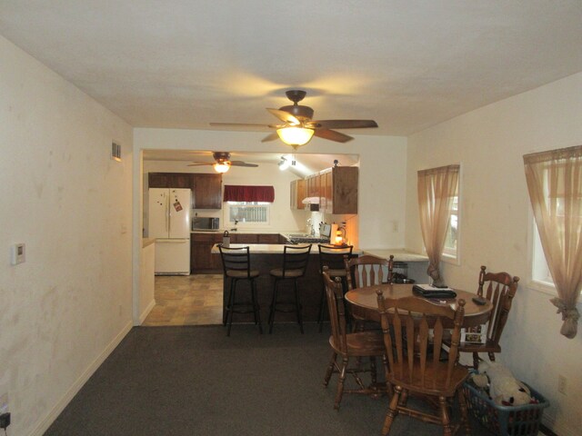 dining room featuring ceiling fan