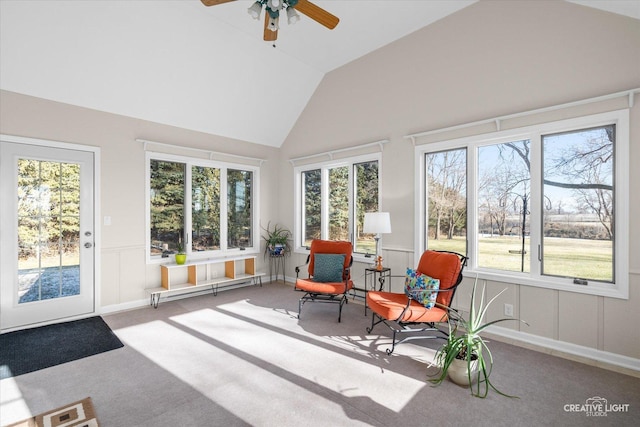 sunroom / solarium with baseboard heating, ceiling fan, and vaulted ceiling