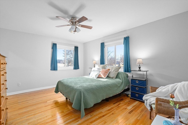 bedroom with light wood-type flooring and ceiling fan