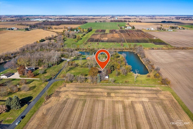 aerial view with a rural view and a water view