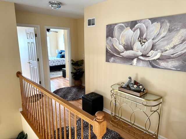 corridor featuring hardwood / wood-style floors