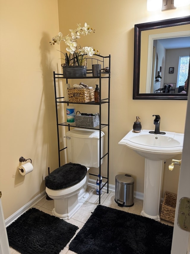 bathroom with tile patterned floors and toilet