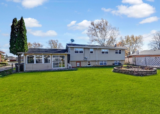 back of property featuring a lawn