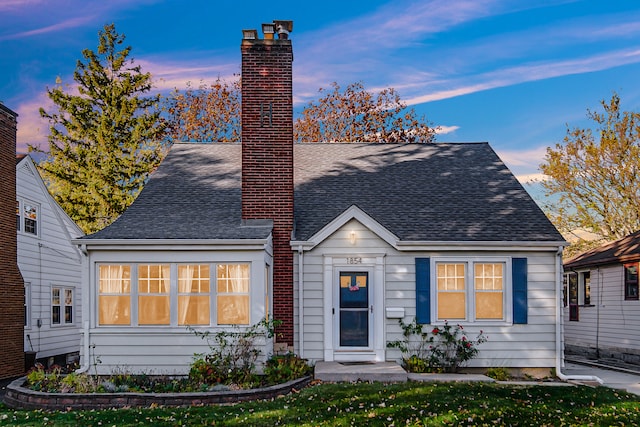 view of front of home with a yard