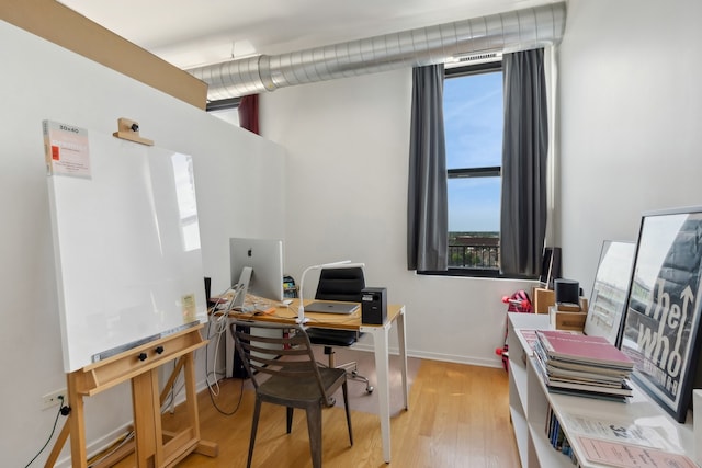 home office featuring light wood-type flooring