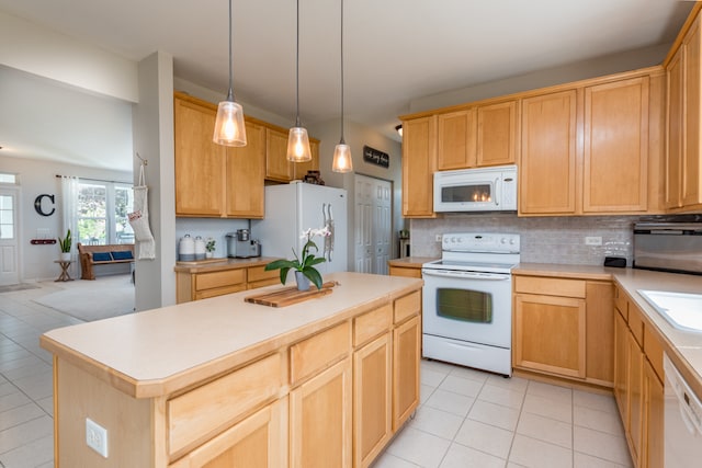 kitchen featuring white appliances, decorative backsplash, light tile patterned floors, and a kitchen island