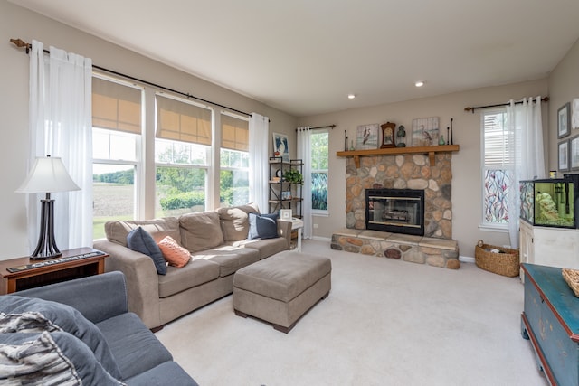 carpeted living room with a fireplace