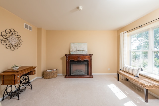 sitting room with light carpet