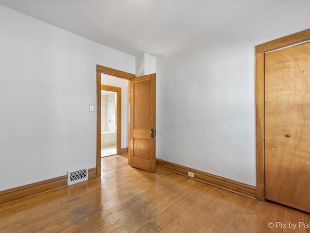 unfurnished room featuring wood-type flooring