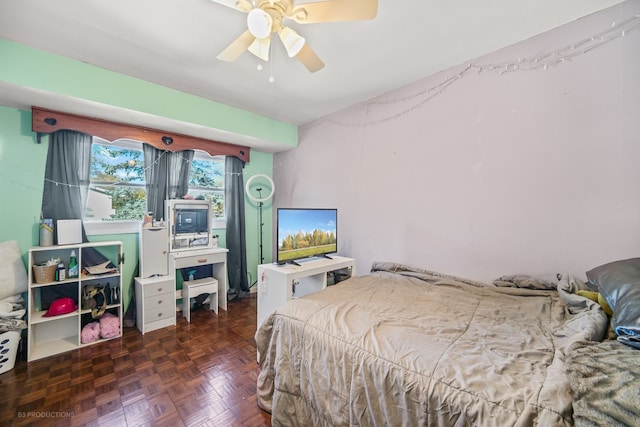 bedroom with ceiling fan and dark parquet floors