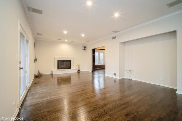 unfurnished living room featuring ornamental molding and dark wood-type flooring