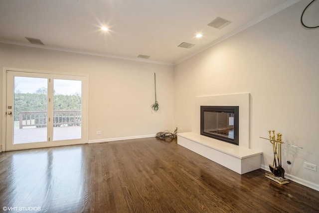 unfurnished living room with crown molding and dark hardwood / wood-style floors