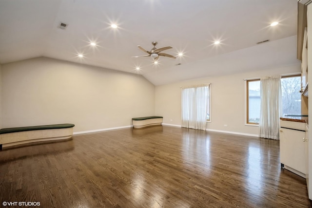 unfurnished living room featuring ceiling fan, lofted ceiling, and dark hardwood / wood-style flooring