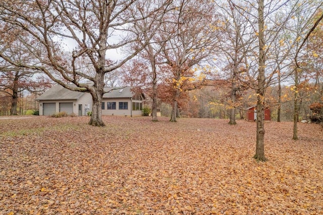 view of yard with a garage