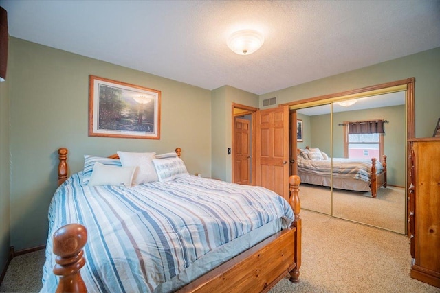 carpeted bedroom featuring a closet