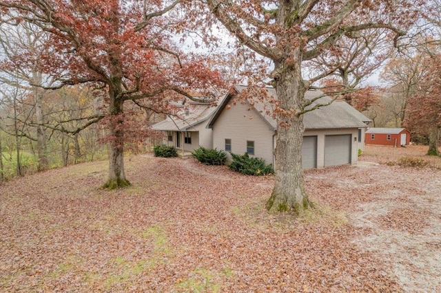 view of property exterior featuring a garage