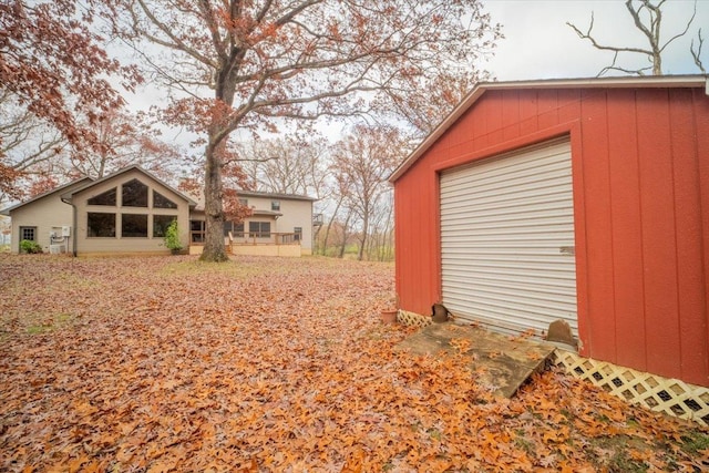 view of yard with an outbuilding and a garage