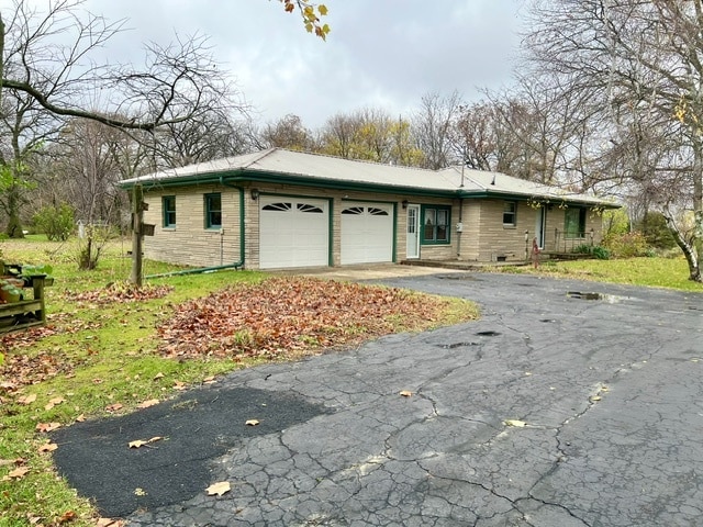 ranch-style home with a garage