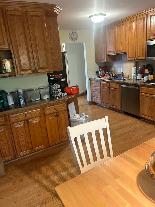 dining room with light hardwood / wood-style flooring