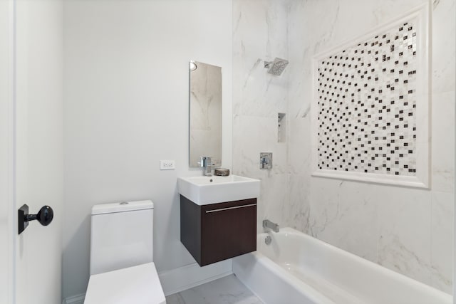 full bathroom featuring toilet, tiled shower / bath combo, and vanity