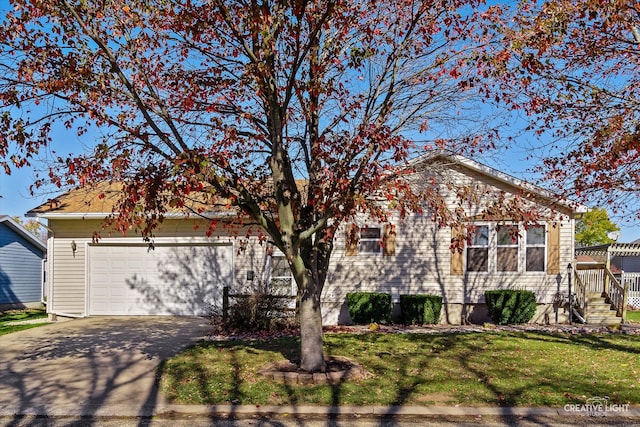 view of front facade featuring a garage and a front lawn