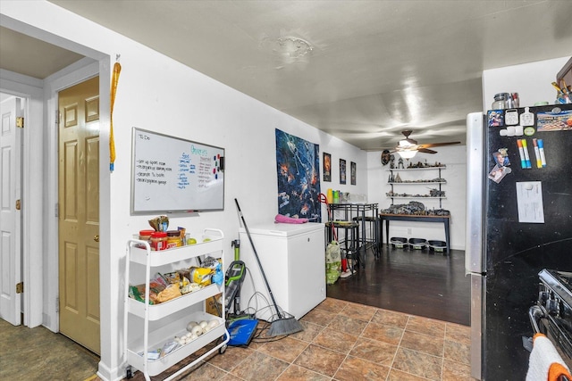 kitchen with fridge, double oven range, a ceiling fan, and freestanding refrigerator