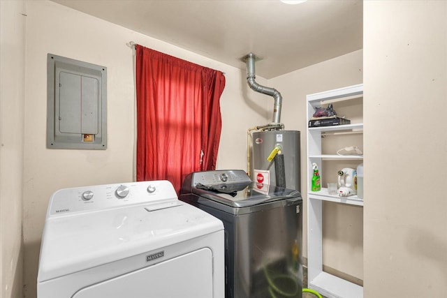 washroom featuring electric panel, laundry area, gas water heater, and separate washer and dryer