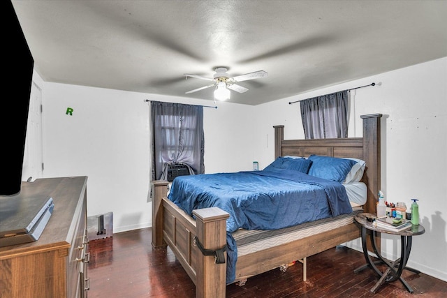 bedroom with baseboards, ceiling fan, and dark wood-style flooring