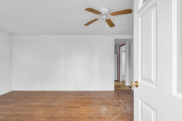 spare room with ceiling fan and wood finished floors