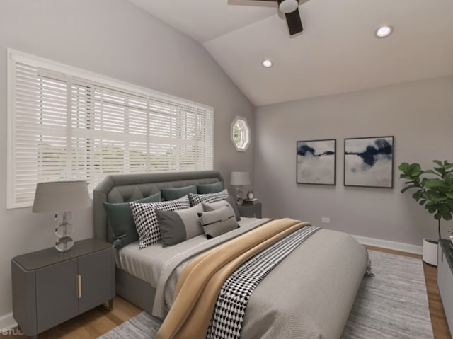 bedroom with vaulted ceiling, light hardwood / wood-style flooring, and ceiling fan