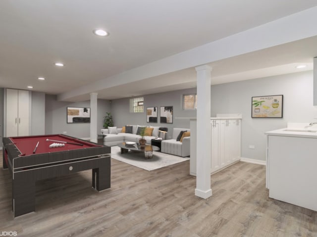 rec room featuring sink, light hardwood / wood-style flooring, and pool table