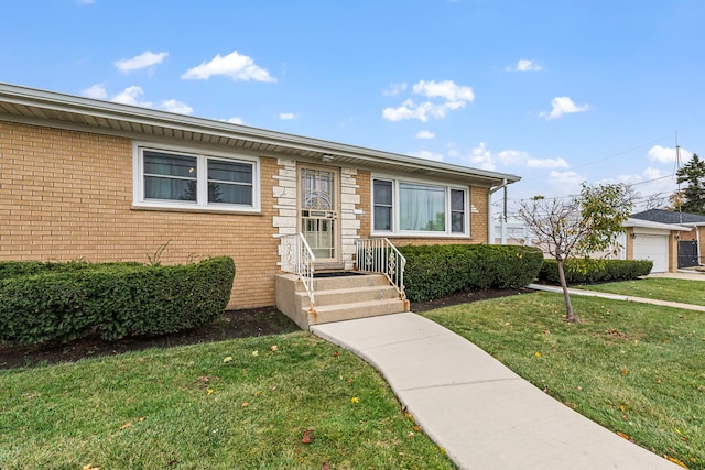 view of front of house with a garage and a front yard