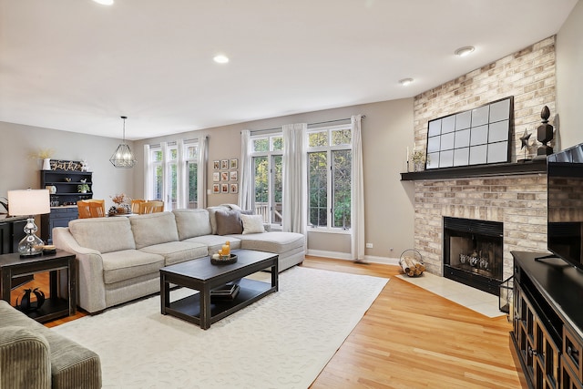 living room featuring a fireplace and hardwood / wood-style floors