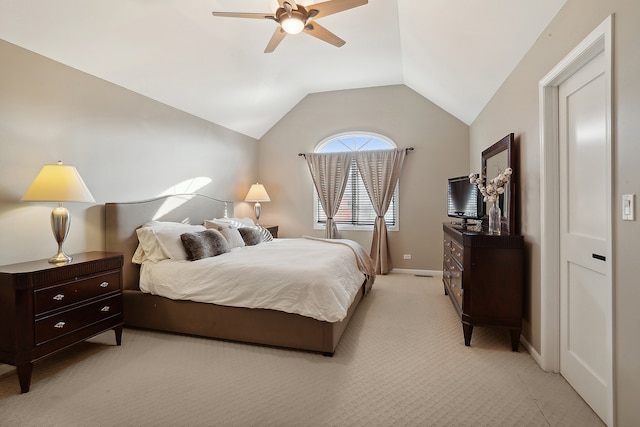 bedroom featuring ceiling fan, light colored carpet, and lofted ceiling