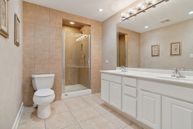 bathroom with vanity, tile patterned floors, toilet, walk in shower, and tile walls