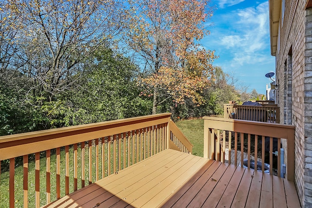 wooden deck with a yard